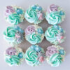Pastel green, purple mix coloured cupcakes.