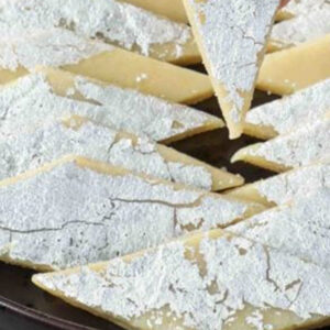 Kaju katli, also known as kaju barfi, is an Indian dessert similar to a barfi. Kaju means cashew; barfi is often made by thickening milk with sugar and other ingredients. Kesar kaju katli includes saffron.