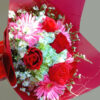 Red roses and pink gerberas mixed flower bunch