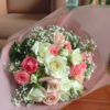 A harmonious blend of romantic pink and pristine white roses creates a soothing and elegant aesthetic.