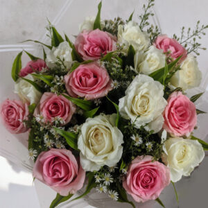 Discover the delicate beauty of our Pink & White Roses with Green Fillers Bouquet
