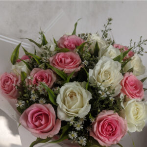 Discover the delicate beauty of our Pink & White Roses with Green Fillers Bouquet