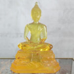 Buddha statue made of yellow colored resin - 5 inch
