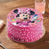 Add a touch of magic to your celebration with this charming Minnie Mouse themed cake! The top features a vibrant, high-quality edible print of the iconic Minnie Mouse in her signature polka-dot dress. The cake is finished with smooth, delightful pink icing and decorated with delicate white sprinkle "polka-dots" along the sides, making it a perfect, whimsical centerpiece for any fan's birthday.